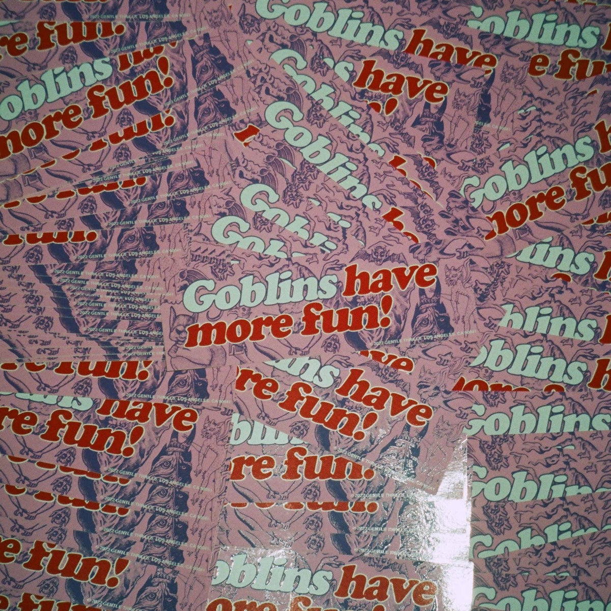 Text pattern with 'Goblins have more fun!' repeated on a multicolored background