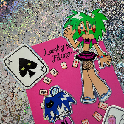 A sticker sheet featuring anime-style characters and playing card graphics on a pink background.