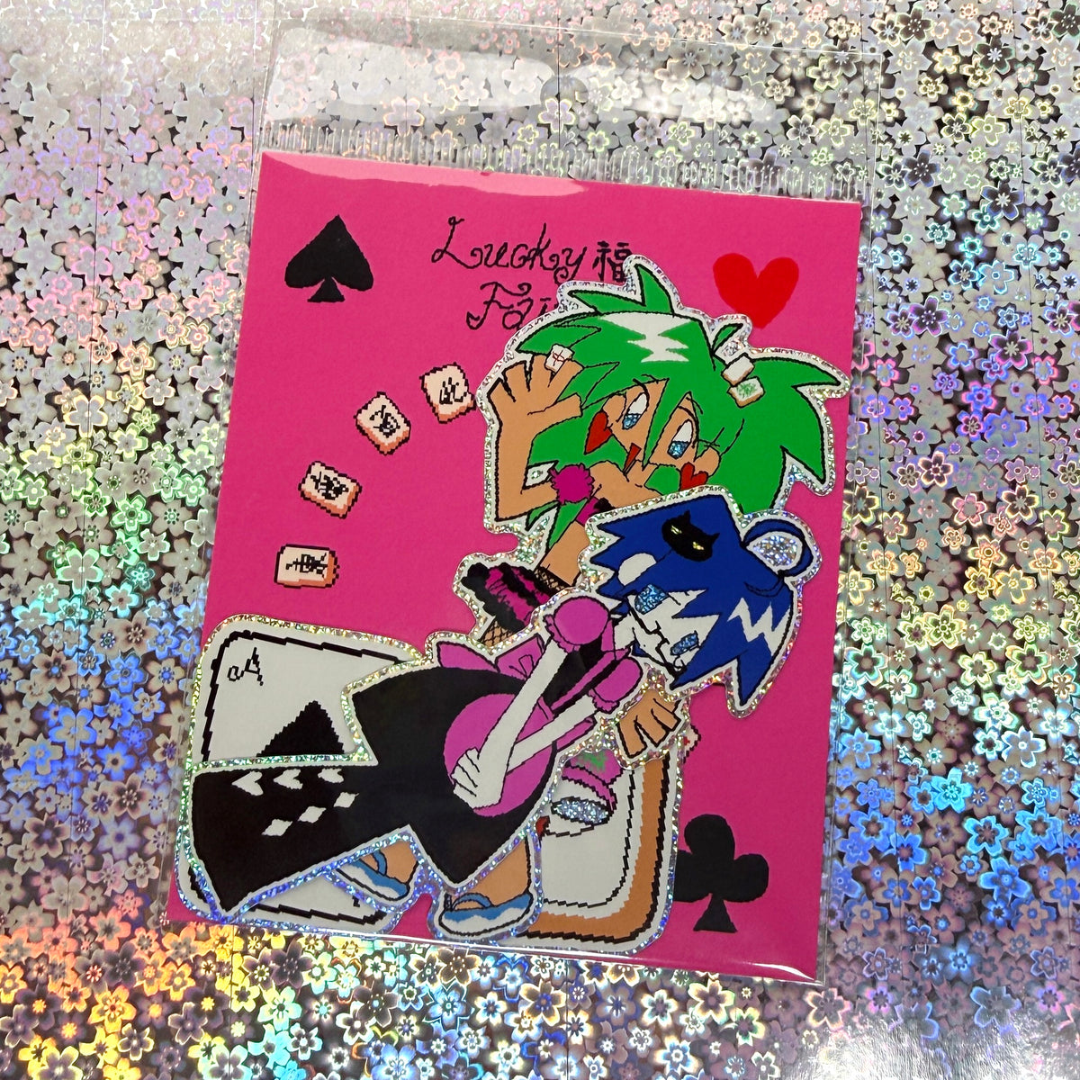 A sticker pack featuring anime-style characters with green and blue hair, surrounded by playing card symbols.